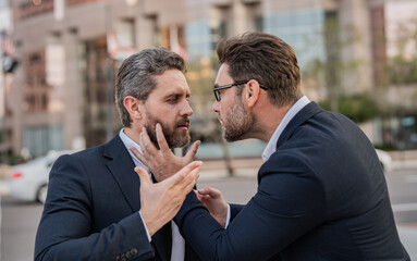 angry fighting businessmen have business conflict. photo of businessmen have business conflict.