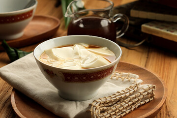 Tau Huay or Douhua. Chinese Soft Soybean Pudding with Sugary Water.