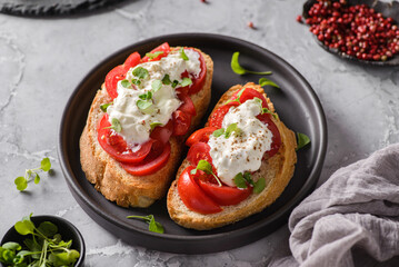 bruschetta with tomatoes and strachatella cheese