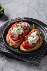 bruschetta with tomatoes and strachatella cheese