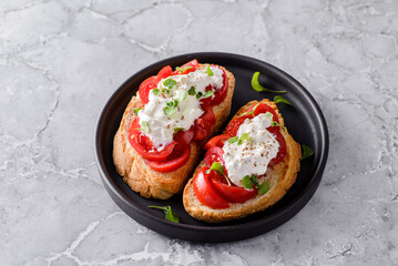 bruschetta with tomatoes and strachatella cheese