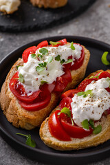 bruschetta with tomatoes and strachatella cheese