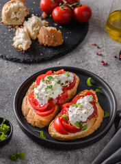bruschetta with tomatoes and strachatella cheese