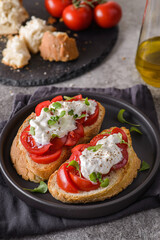 bruschetta with tomatoes and strachatella cheese