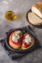 bruschetta with tomatoes and strachatella cheese