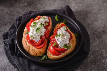 bruschetta with tomatoes and strachatella cheese