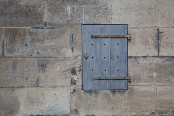Stone wall with a little door