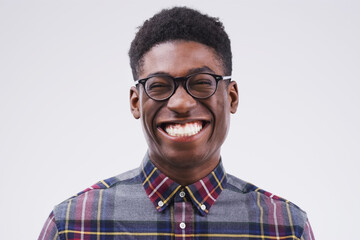 Portrait, mockup and black man with a smile, funny and confident against a grey studio background....