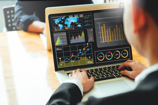 Analyst working with Laptop  Business Analytics and Data Management System to make report  KPI Corporate strategy for finance, operations, sales, marketing. metrics connected to database.