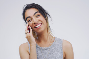 Fototapeta premium Phone call, funny or portrait of woman talking in studio isolated on white background. Cellphone, laughing or face of female person in communication, speaking or discussion with comedy or comic joke