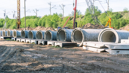 Reinforced concrete pipe for laying communications..Pipelines of household and storm sewers. Pipes made of heavy-duty concrete grades - obrazy, fototapety, plakaty