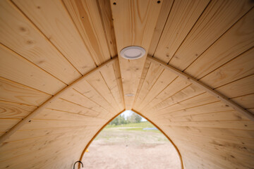 Close-up of round LED lamps on the ceiling of the igloo sauna