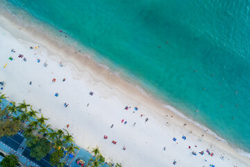 Aerial view of amazing beach with people relax on the beach sea, Beautiful Patong beach Phuket Thailand,Amazing sea beach sand tourist travel destination in andaman sea,Travel and tour concept