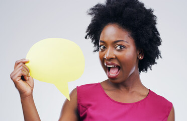 Happy black woman, portrait and speech bubble in surprise for question or social media against a white studio background. African female person with afro or sign for comment or FAQ on mockup space