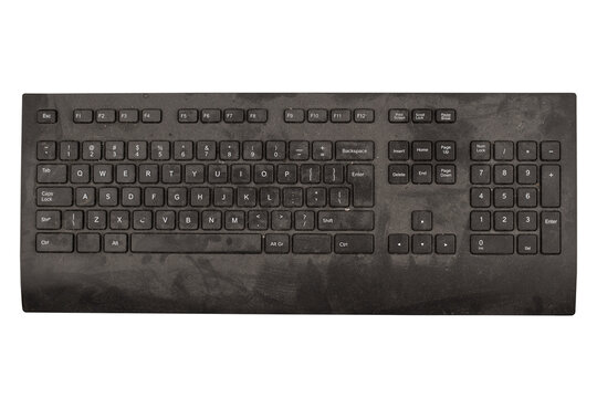 old black keyboard with keys covered in dust and dirt isolated on white background