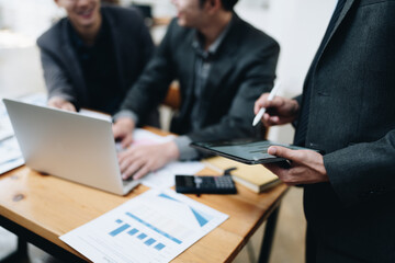 startup business, business advisor explaining strategy for planning finance investment teamwork paperwork audit and discussing marketing, profit, budget of company in meeting room.