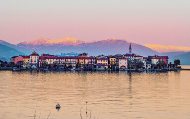 Evocative sunset over Lake Maggiore,Borromeo Gulf and Isola Pescatori.Piedmont,Italy.