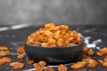 Raisins. Sun-dried grapes in bowl. superfood. Vegetarian food concept. healthy snacks