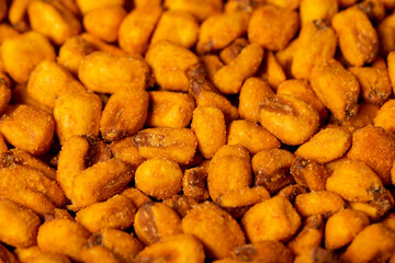 Corn nuts with sauce. Roasted corn snack close up food background. texture. copy space banner
