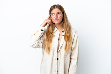 Young blonde woman isolated on white background making the gesture of madness putting finger on the head