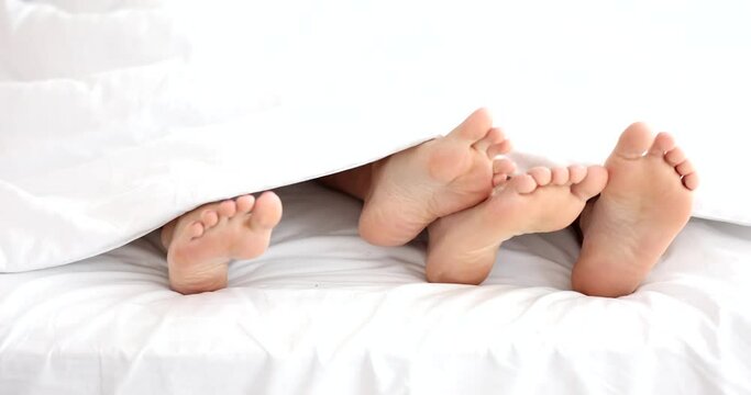 Man and woman in bed at home ignore each other in bed. Problems in relationships and intimate family life