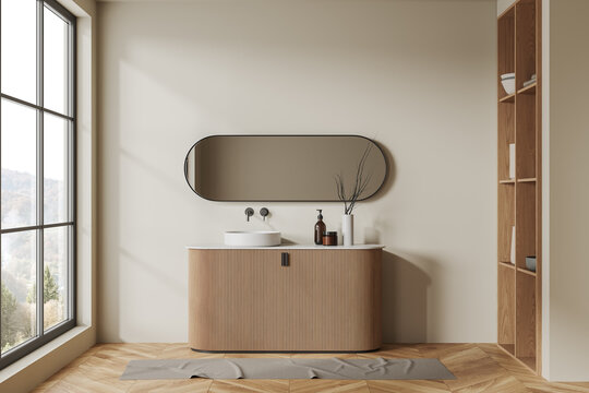 Comfortable beige bathroom with sink and mirror