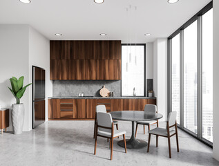 White kitchen interior with dining table and cooking space, panoramic window