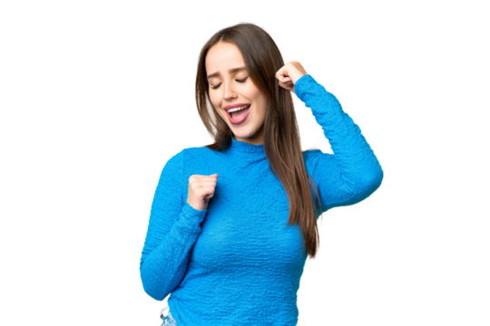 Young beautiful woman over isolated chroma key background celebrating a victory