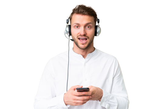 Telemarketer caucasian man working with a headset over isolated chroma key background surprised and sending a message