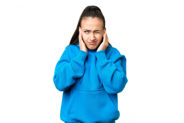 Young Arabian woman over isolated chroma key background frustrated and covering ears