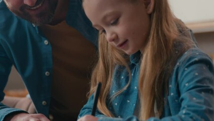 Caucasian dad helping teenage daughter schoolgirl with online homeschooling e-learning study at home kitchen table at home using pc laptop computer father help child girl kid with lesson homework - Powered by Adobe