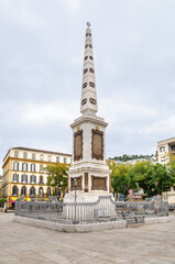 Fototapeta na wymiar MALAGA, SPAIN - FEBRUARY 08: Merced Square in the center of the city on February 08, 2014 in Malaga, Spain. View of General Torrijos obelisk.