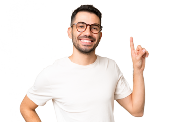 Young handsome caucasian man over isolated chroma key background showing and lifting a finger in sign of the best