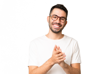 Young handsome caucasian man over isolated chroma key background applauding after presentation in a conference