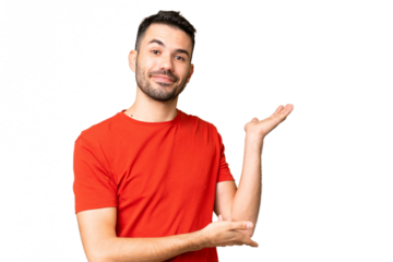 Young handsome caucasian man over isolated chroma key background extending hands to the side for inviting to come
