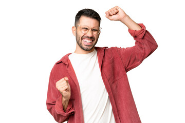 Young handsome caucasian man over isolated chroma key background celebrating a victory