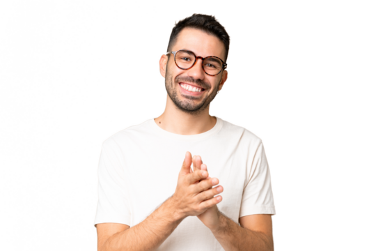 Young handsome caucasian man over isolated chroma key background applauding after presentation in a conference