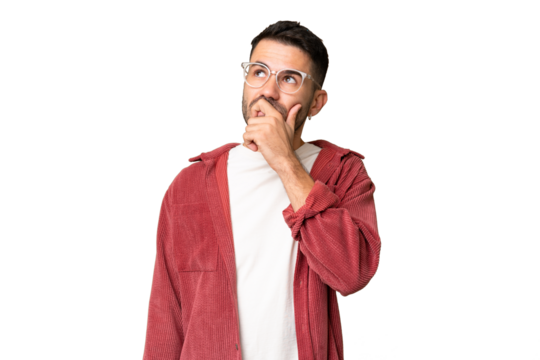 Young handsome caucasian man over isolated chroma key background having doubts and with confuse face expression