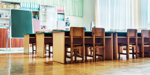 Empty classroom with wooden chairs of daycare center or school