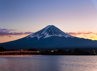 Fototapeta na wymiar Mt. Fuji at dusk over Lake Kawaguchi in Japan. Generated AI