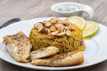 sayadieh, sayadiya, Rice with fish topped with almonds and tahini paste 