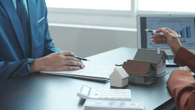 Real estate agent and realtor general liability insurance businessman professional consultant with house toy model