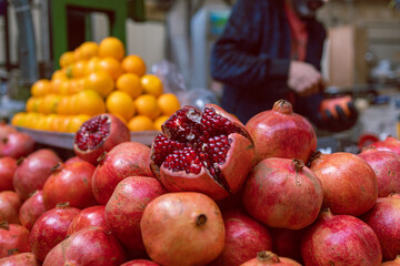 Red and delicious pomegranate - sweet fruits and at the market