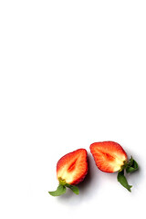 Two halves of Strawberry berries on a white background with copy space for greeting card. Frame for text, postcards, invitations in a minimalist style.