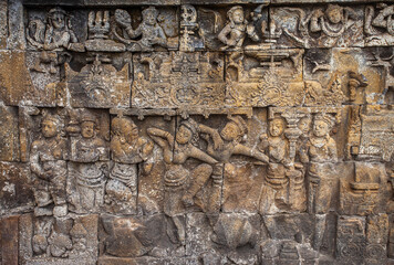 Reliefs on the walls of the Borobudur temple in Magelang, Central Java, Indonesia. there are about 1,400 relief panels, the reliefs depict the story of the Buddha and his teachings.