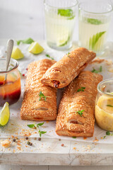 Fresh and delicious hot dogs with ketchup, mustard and herbs.