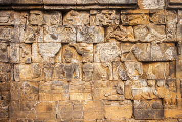Reliefs on the walls of the Borobudur temple in Magelang, Central Java, Indonesia. there are about 1,400 relief panels, the reliefs depict the story of the Buddha and his teachings.