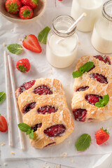Delicious strawberry yeast cake served with milk.
