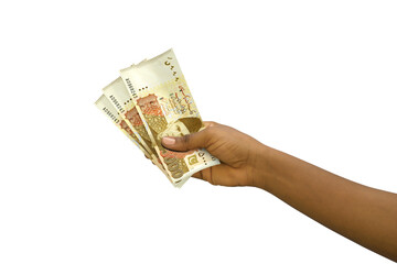 Fair hand holding Pakistani Rupee notes isolated on transparent background