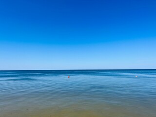Fototapeta na wymiar Blue sea horizon and blue sky